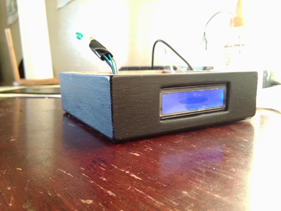 Surf Orb LCD screen showing swell information
